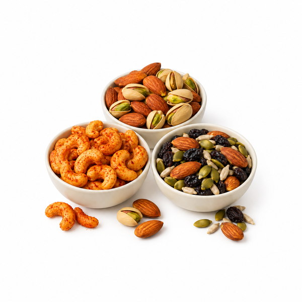 Roasted almonds, pistachios, chilli cashews and a nut, raisin and seed snack mix in bowls